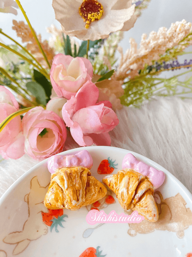 Miniature croissant chopsticks/brush rest