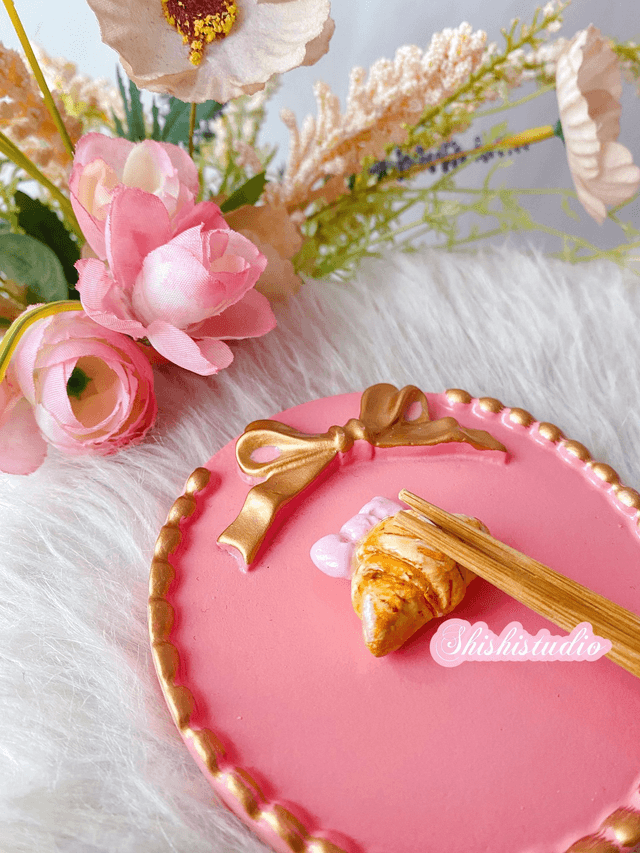 Miniature croissant chopsticks/brush rest