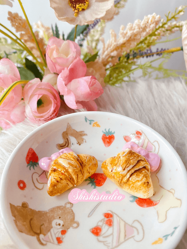 Miniature croissant chopsticks/brush rest