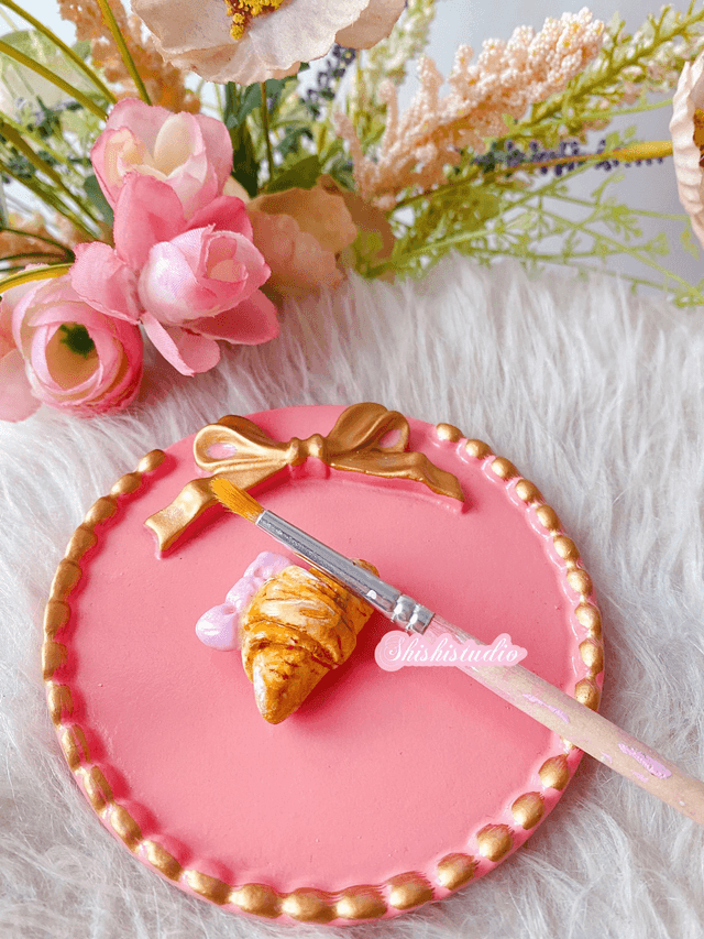 Miniature croissant chopsticks/brush rest