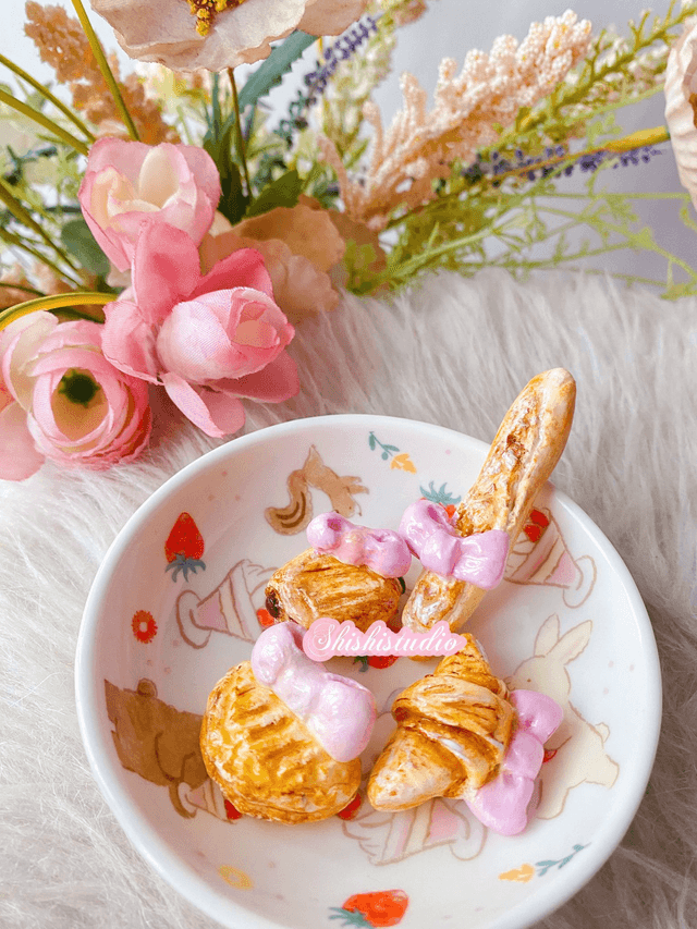 Miniature croissant chopsticks/brush rest